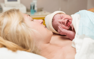 Newborn baby with mother