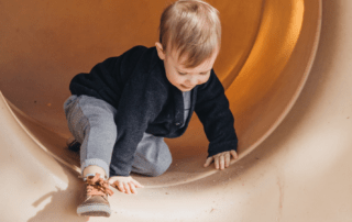 Child playing in slide